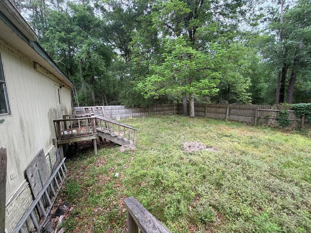 86 Whippoorwill Lane Trinity, TX 75862 - Photo 6 of 47 a backyard of a house with lots of green space
