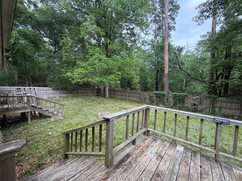 86 Whippoorwill Lane Trinity, TX 75862 - Photo 8 of 47 a view of balcony with deck and trees