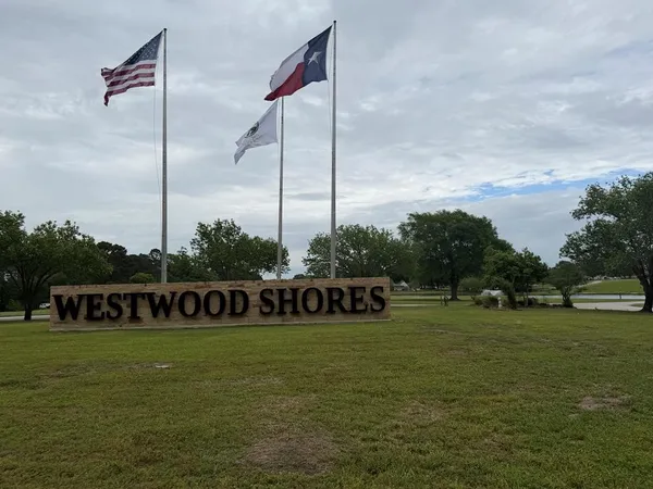 a view of a park with welcome board
