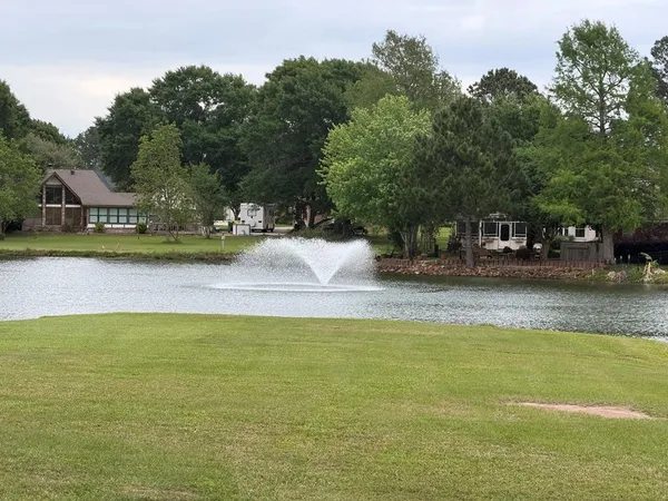 a swimming pool is sitting in the middle of a lake
