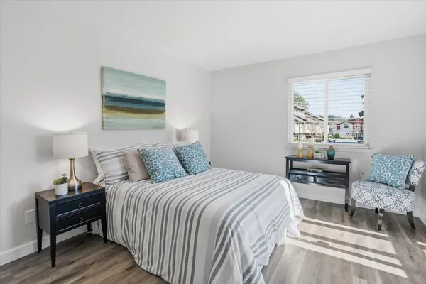 a bedroom with a bed and a couch