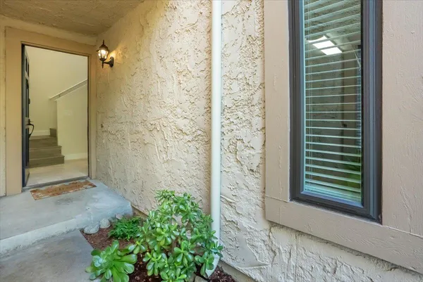 a view of a door and a window