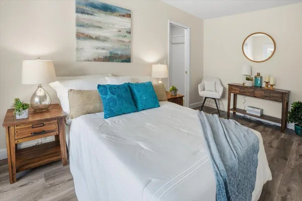 a bed room with a bed and a lamp