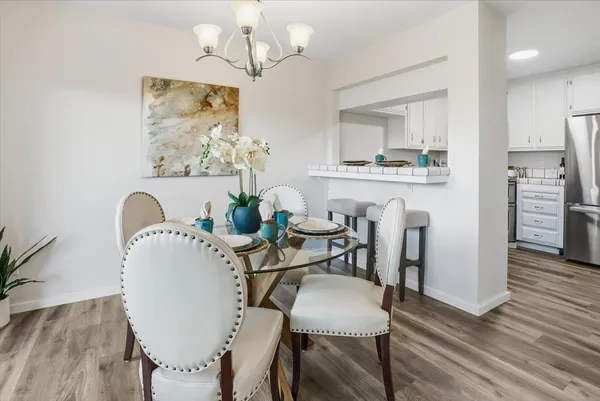 a view of a dining room with furniture and wooden floor