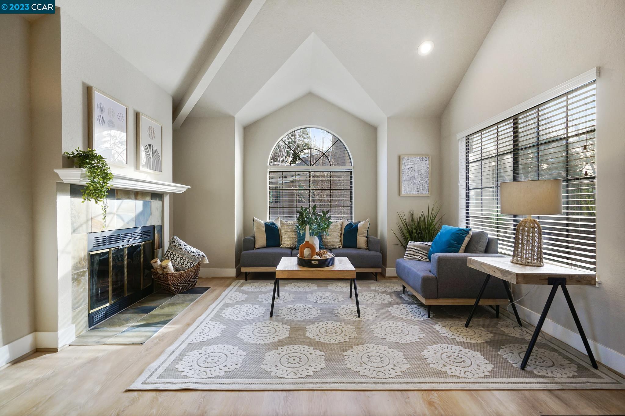 218 Copper Ridge Road San Ramon, CA 94582 - Photo 1 of 1 a living room with furniture a fireplace and a table