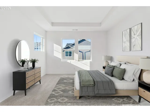 a view of an empty room with wooden floor and window