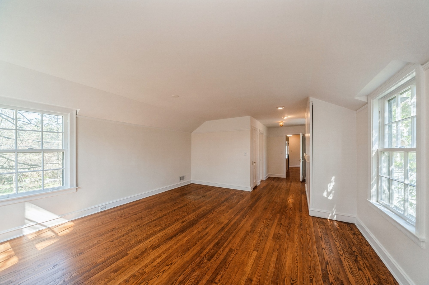 872 Green Bay Road Highland Park, IL 60035 - Photo 13 of 30 an empty room with wooden floor and windows