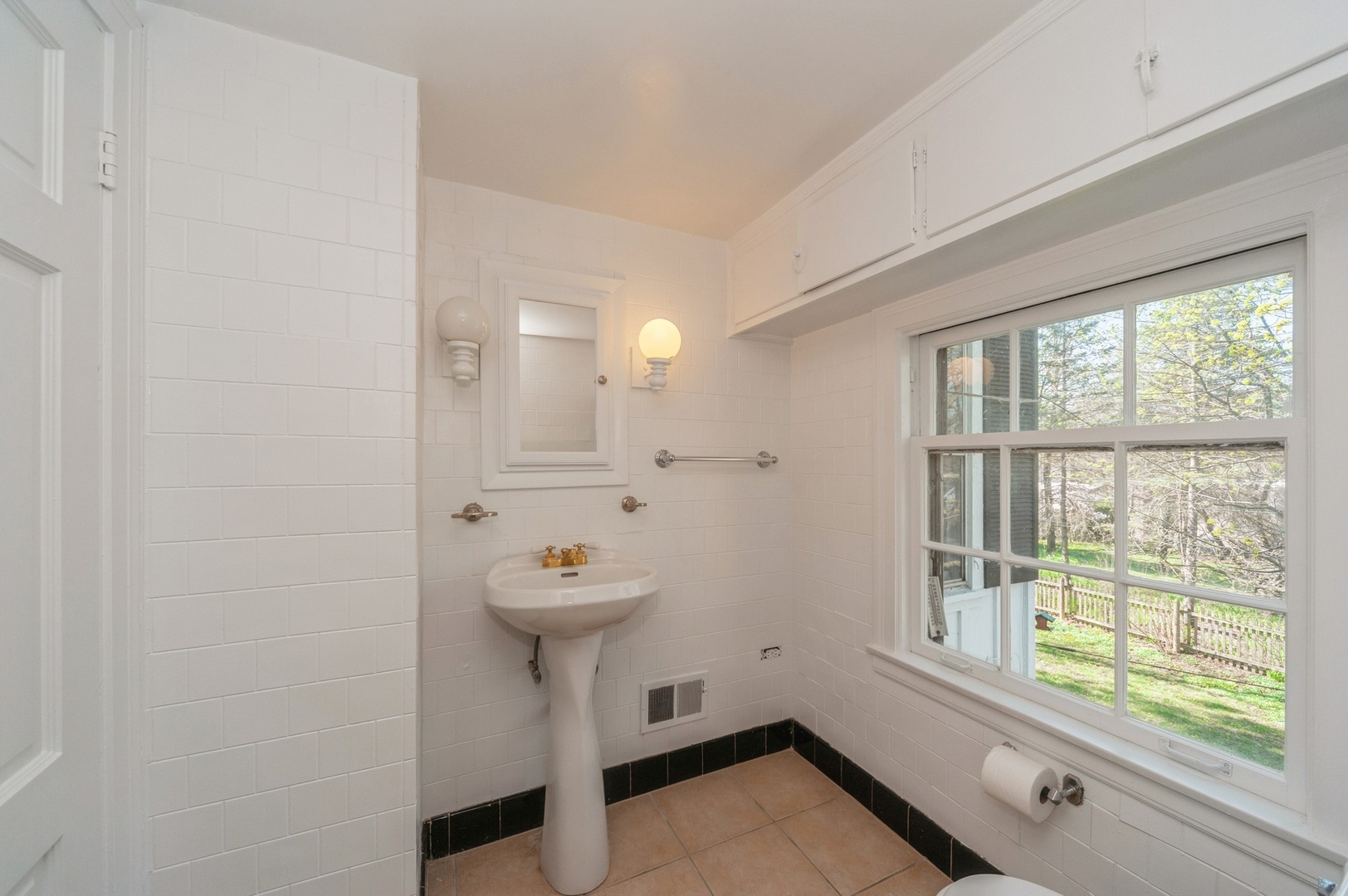 872 Green Bay Road Highland Park, IL 60035 - Photo 19 of 30 a view of a bathroom with a sink and mirror