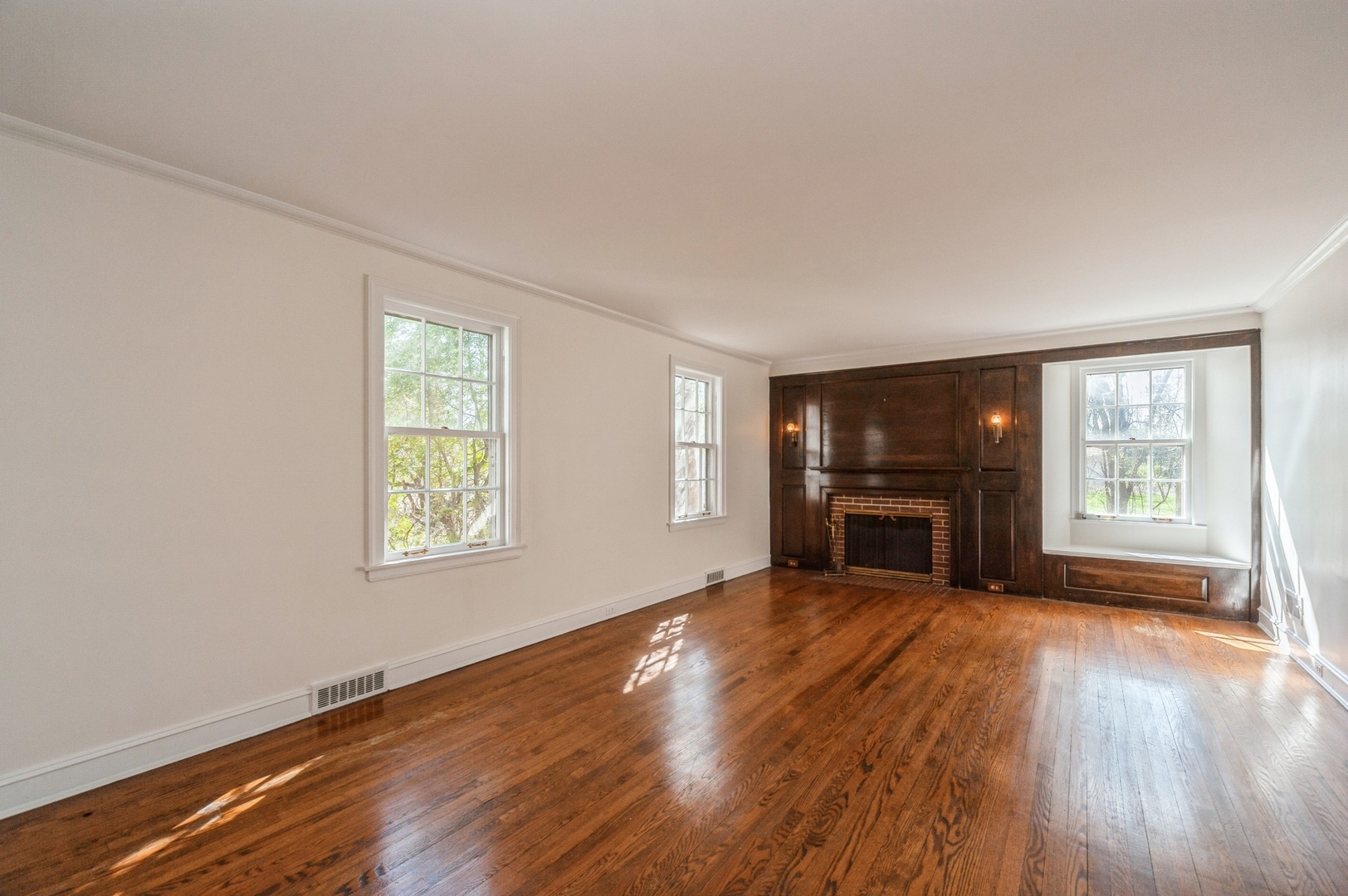 872 Green Bay Road Highland Park, IL 60035 - Photo 5 of 30 a view of empty room with wooden floor and fireplace