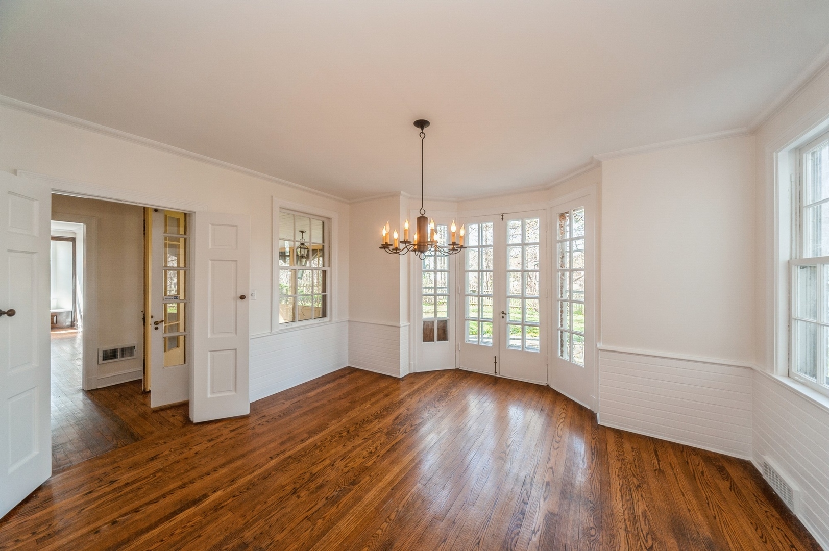 872 Green Bay Road Highland Park, IL 60035 - Photo 6 of 30 a view of an empty room with wooden floor and a window