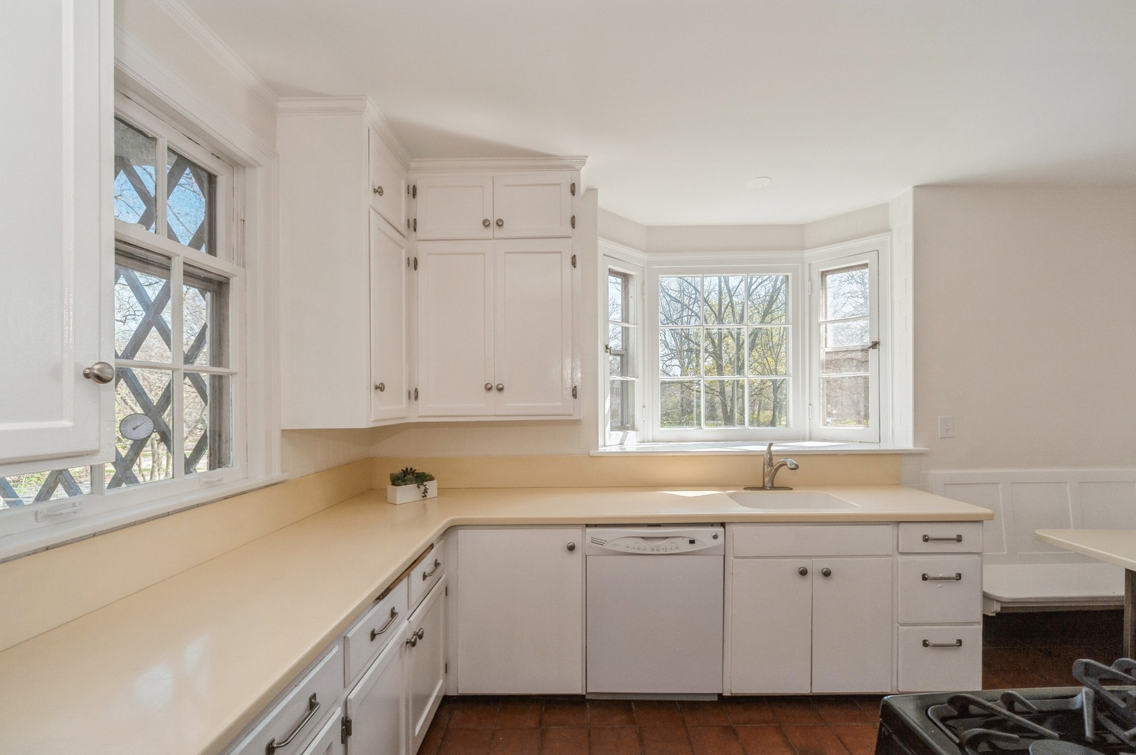 872 Green Bay Road Highland Park, IL 60035 - Photo 7 of 30 a kitchen with granite countertop white cabinets and a sink