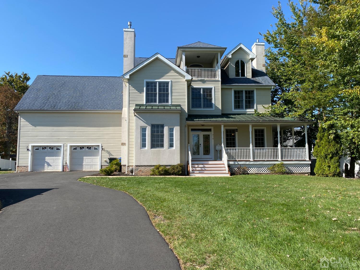 418 Cliff Road Sewaren, NJ 07077 - Photo 1 of 63 a front view of a house with a yard