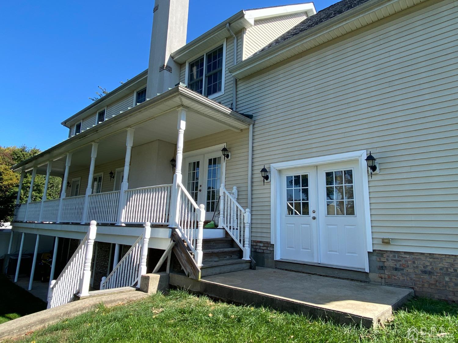 418 Cliff Road Sewaren, NJ 07077 - Photo 11 of 63 a front view of a house with a yard