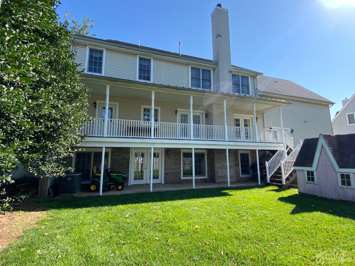 418 Cliff Road Sewaren, NJ 07077 - Photo 12 of 63 a front view of a house with a garden