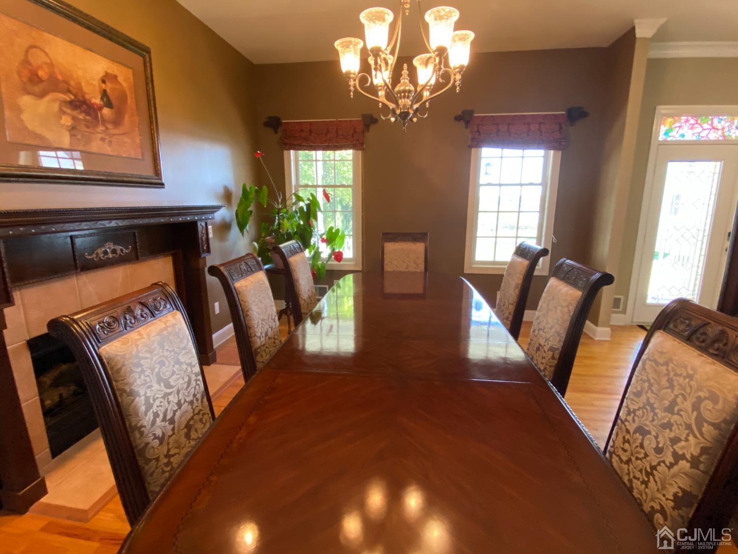 418 Cliff Road Sewaren, NJ 07077 - Photo 16 of 63 a view of a livingroom with furniture window and wooden floor