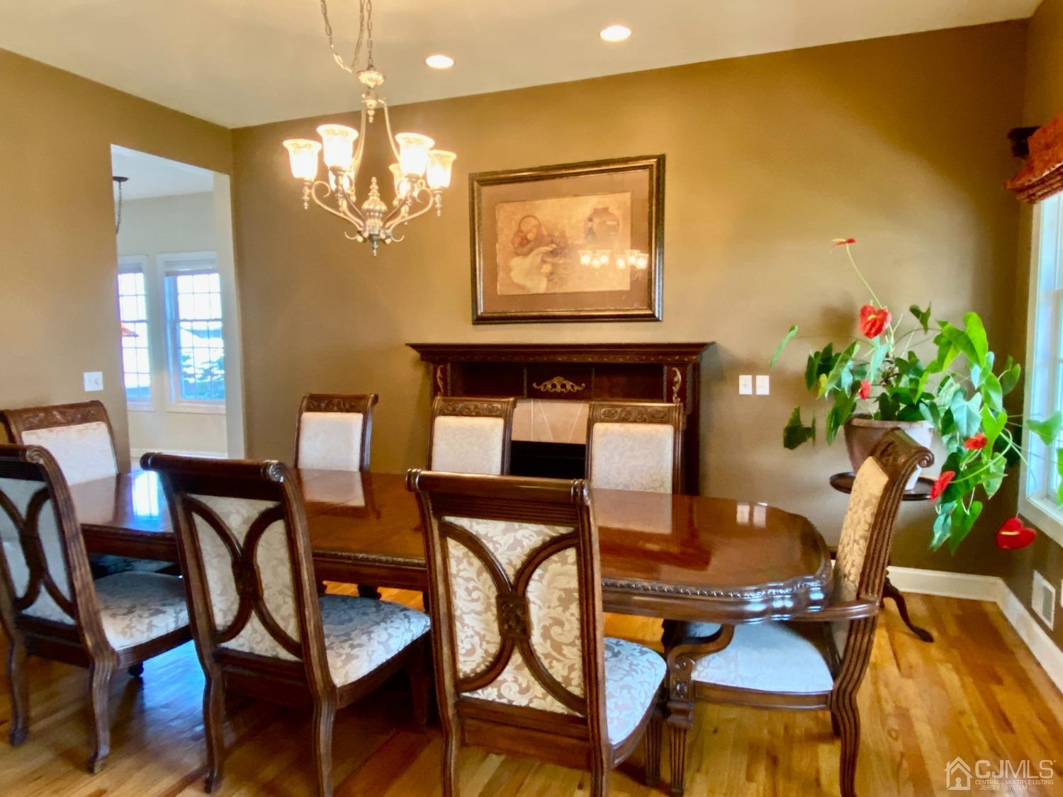 418 Cliff Road Sewaren, NJ 07077 - Photo 18 of 63 a view of a dining room with furniture and chandelier