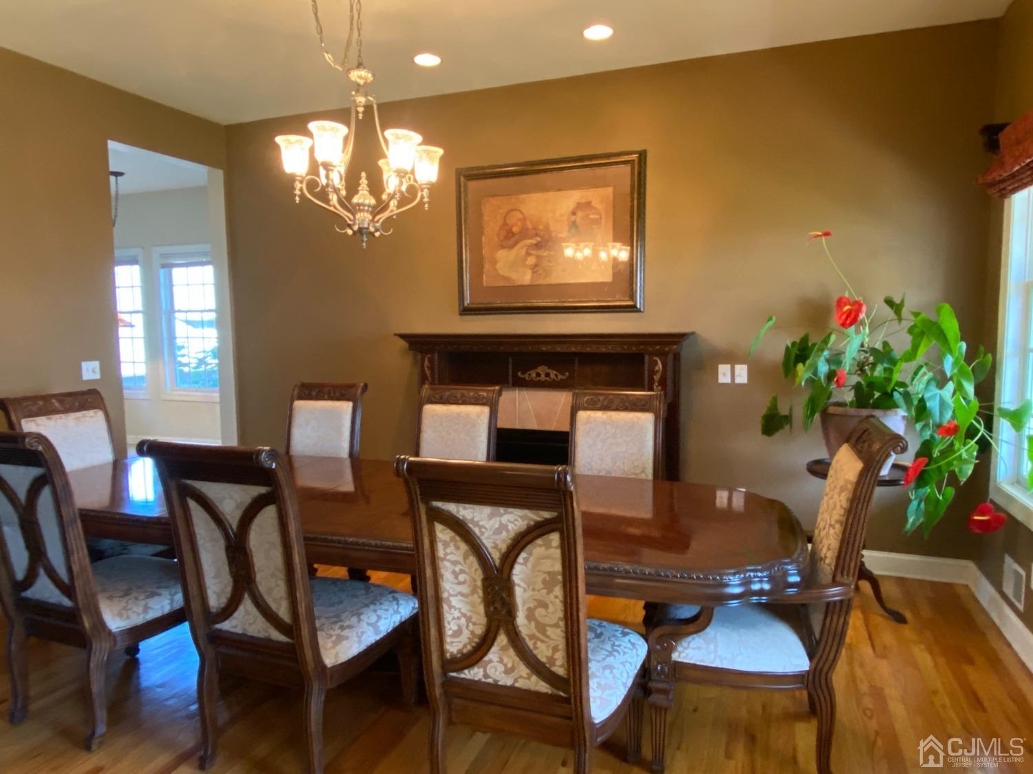 418 Cliff Road Sewaren, NJ 07077 - Photo 19 of 63 a view of a dining room with furniture and a chandelier