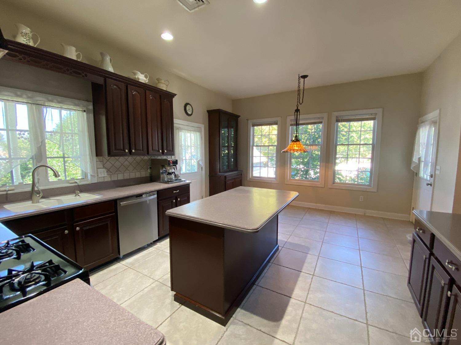 418 Cliff Road Sewaren, NJ 07077 - Photo 26 of 63 a kitchen with a sink a counter top space and appliances