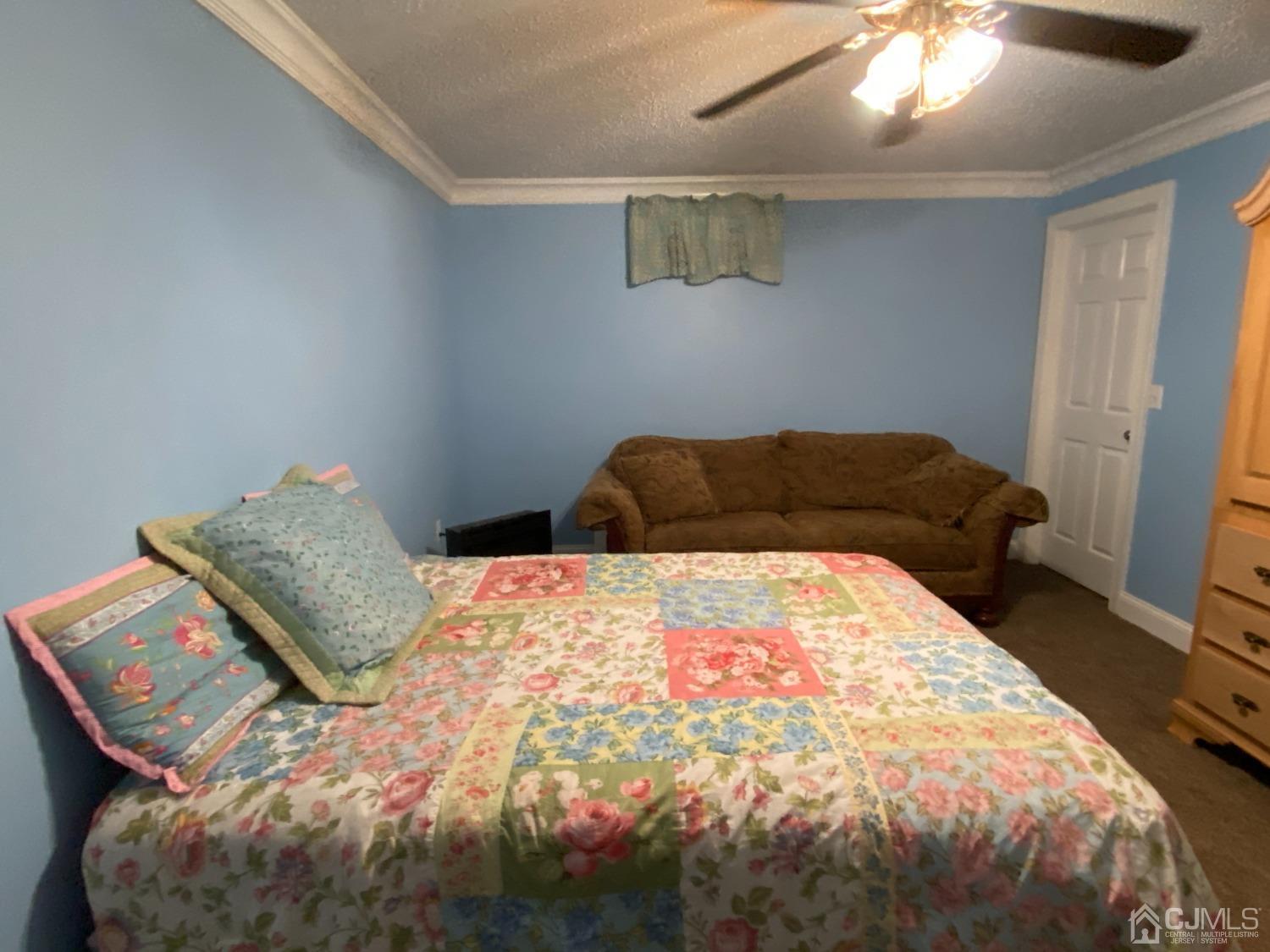 418 Cliff Road Sewaren, NJ 07077 - Photo 33 of 63 a bedroom with a bed and a window