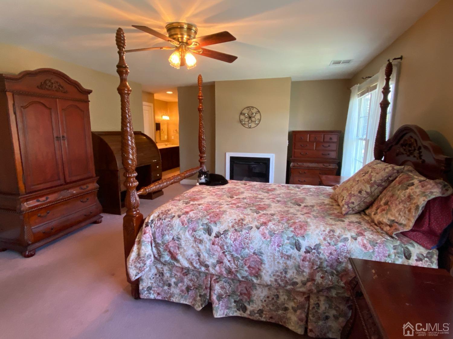 418 Cliff Road Sewaren, NJ 07077 - Photo 36 of 63 a bedroom with a bed dresser and a chair