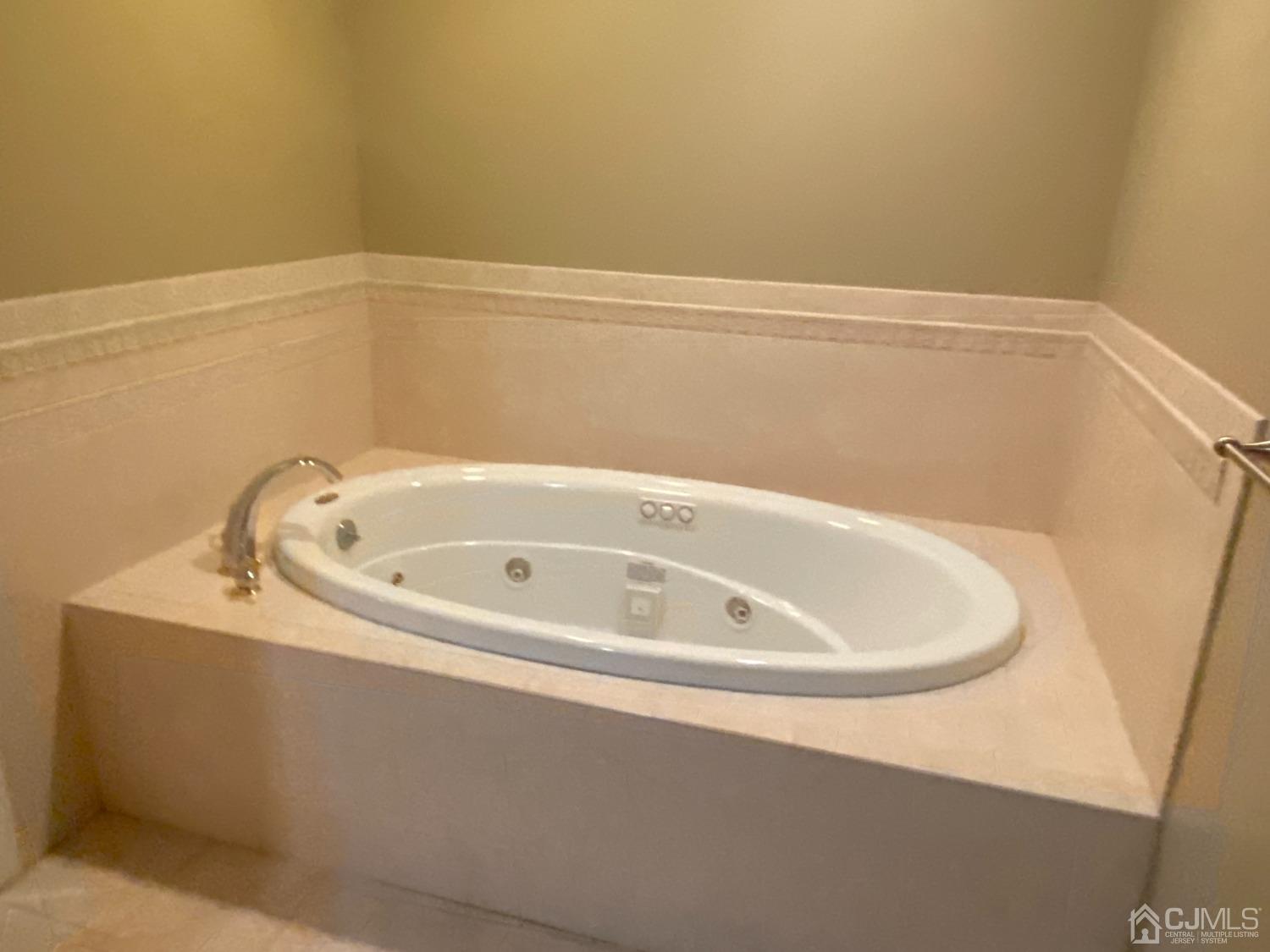 418 Cliff Road Sewaren, NJ 07077 - Photo 38 of 63 a white bath tub sitting in a bathroom
