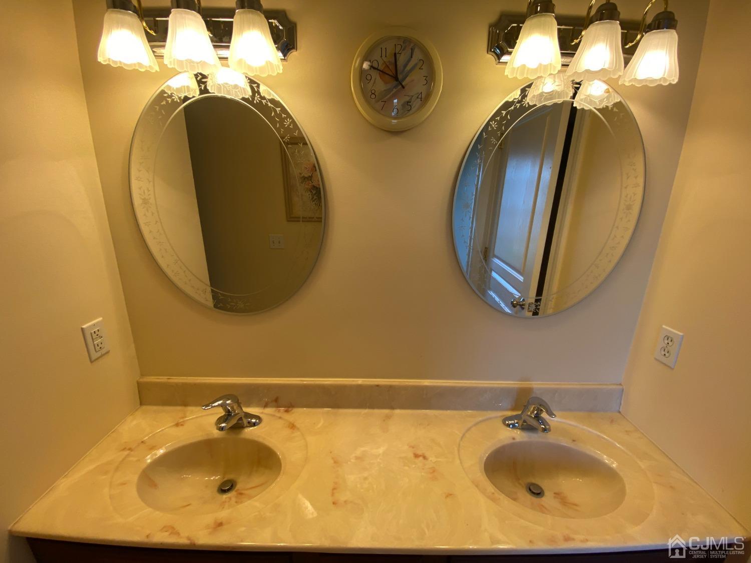 418 Cliff Road Sewaren, NJ 07077 - Photo 42 of 63 a bathroom with a sink and a mirror