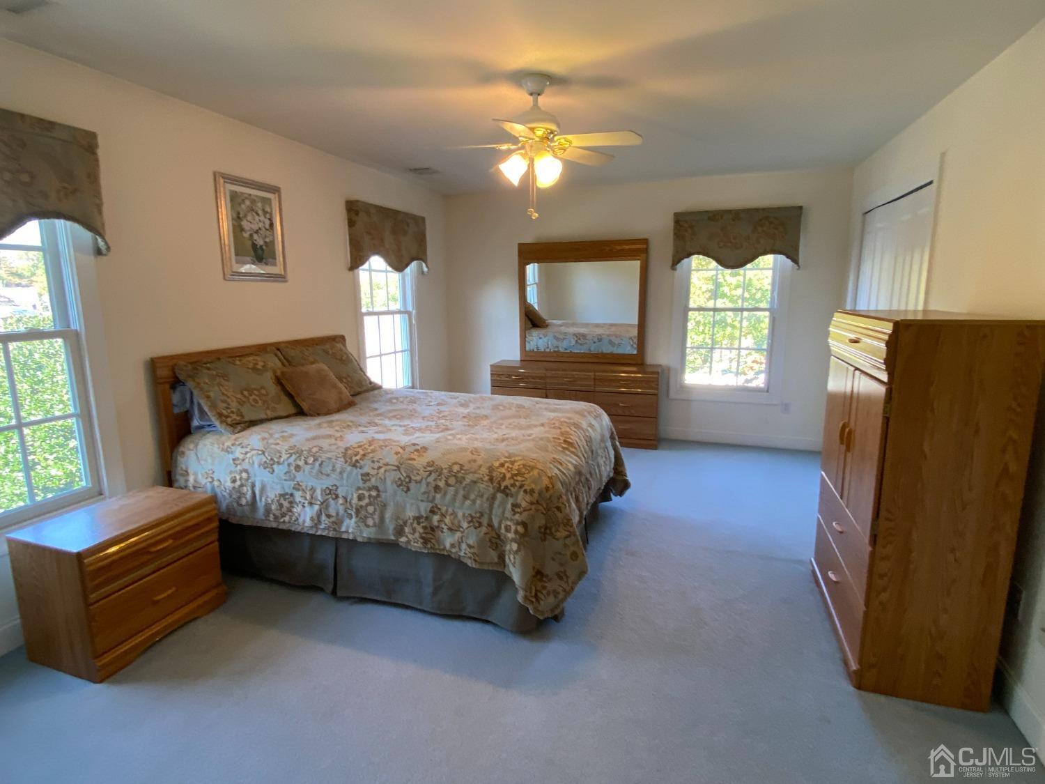 418 Cliff Road Sewaren, NJ 07077 - Photo 47 of 63 a bedroom with a bed dresser and a window