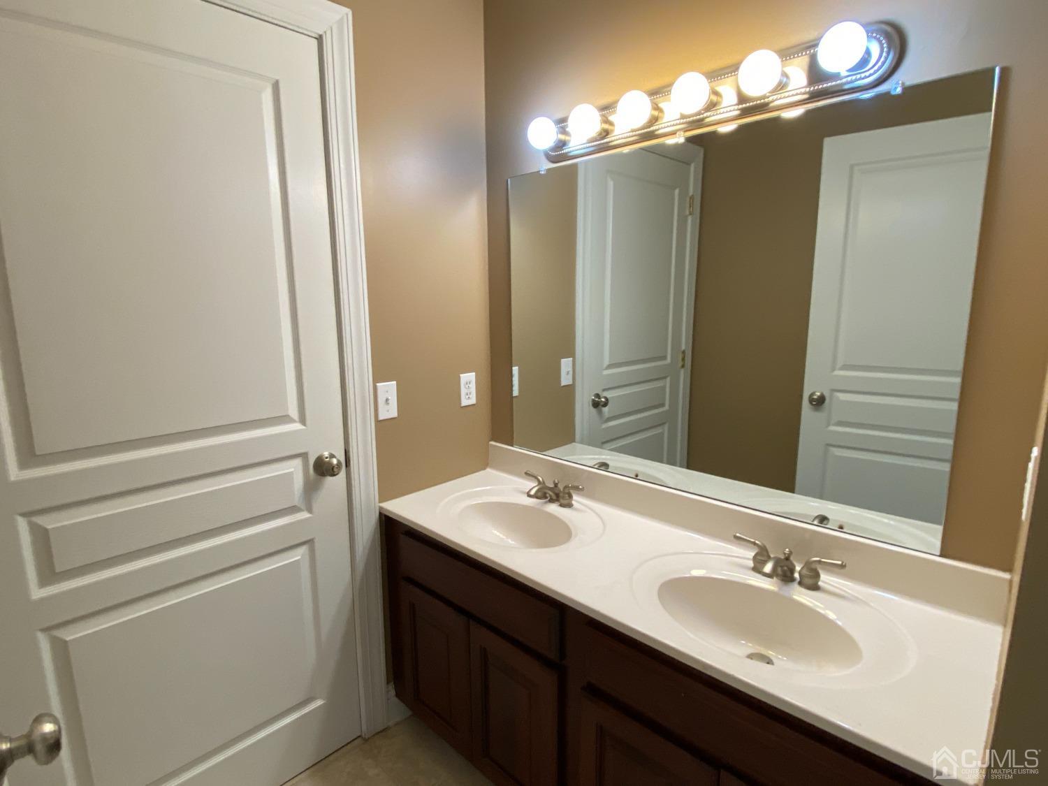 418 Cliff Road Sewaren, NJ 07077 - Photo 49 of 63 a bathroom with a sink and a mirror