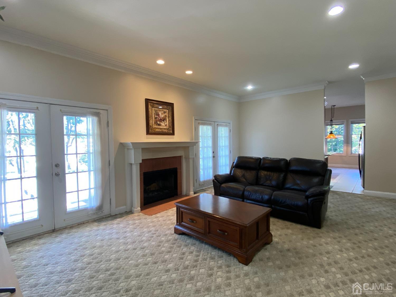 418 Cliff Road Sewaren, NJ 07077 - Photo 5 of 63 a living room with furniture and a fireplace