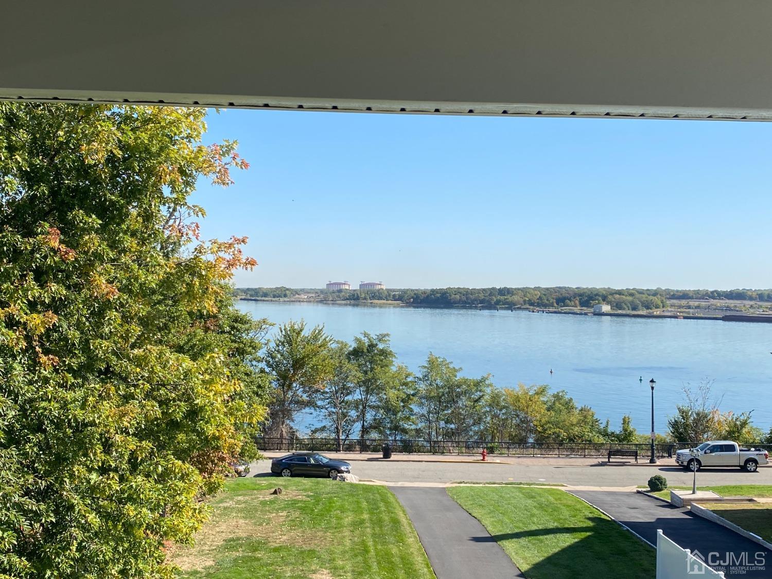 418 Cliff Road Sewaren, NJ 07077 - Photo 53 of 63 a view of a lake from a yard
