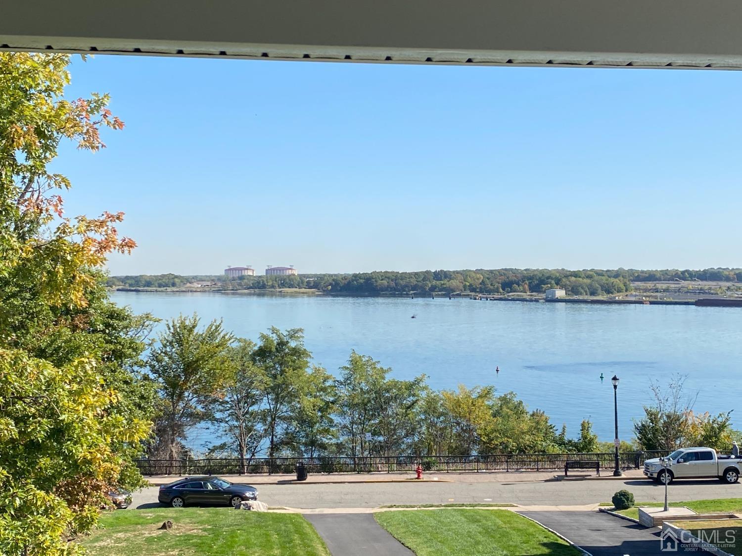 418 Cliff Road Sewaren, NJ 07077 - Photo 54 of 63 a view of a lake with houses in the back