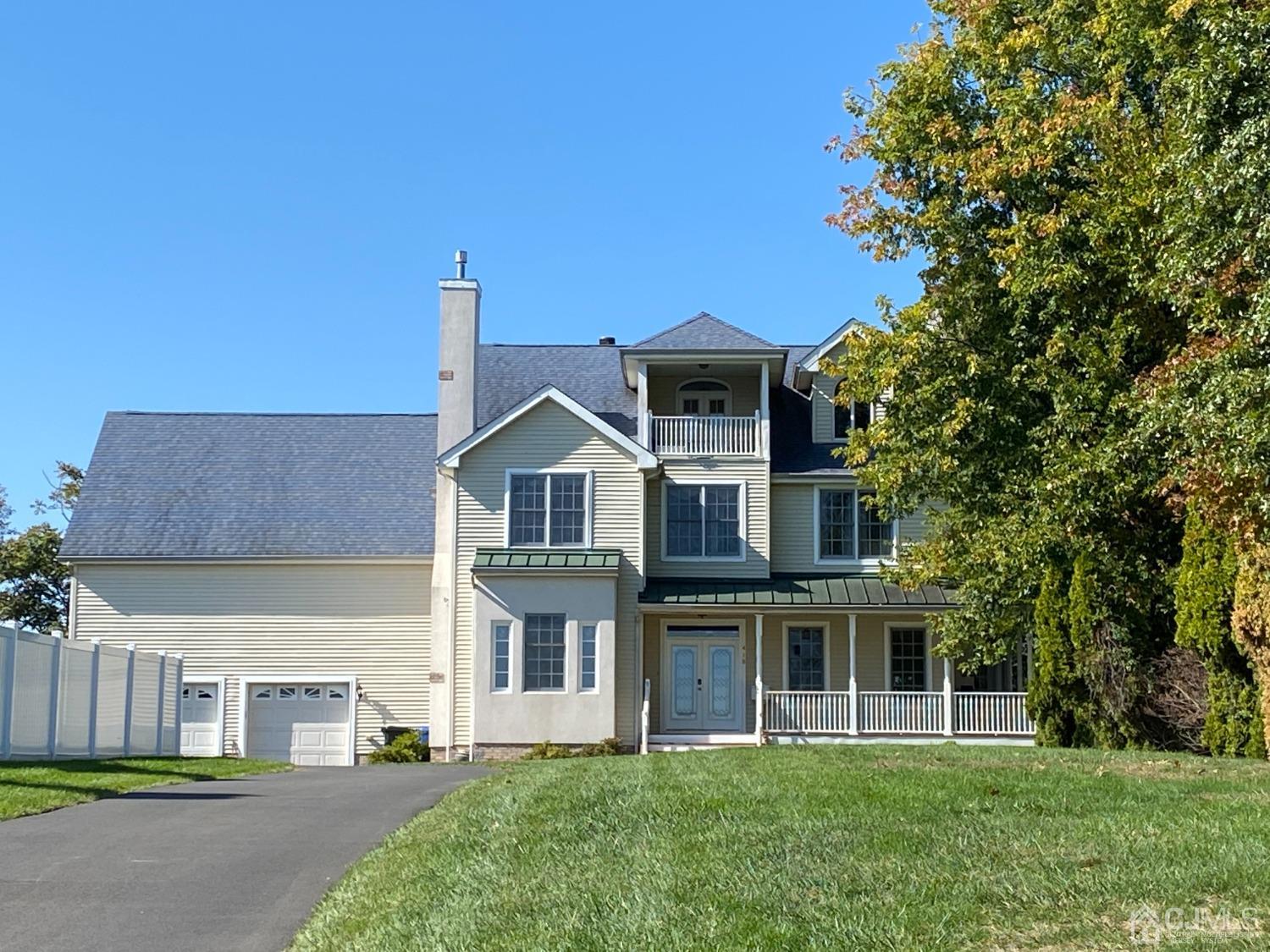 418 Cliff Road Sewaren, NJ 07077 - Photo 10 of 63 a front view of a house with a garden