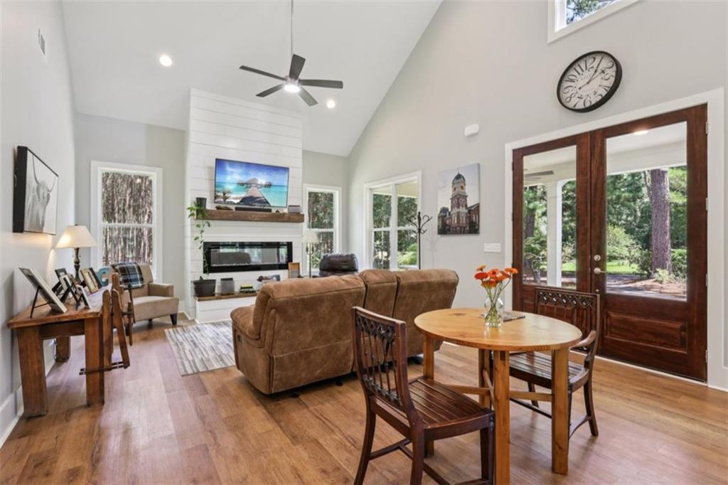 250 Stagecoach Road Oxford, GA 30054 - Photo 14 of 76 a living room with fireplace furniture and a large window