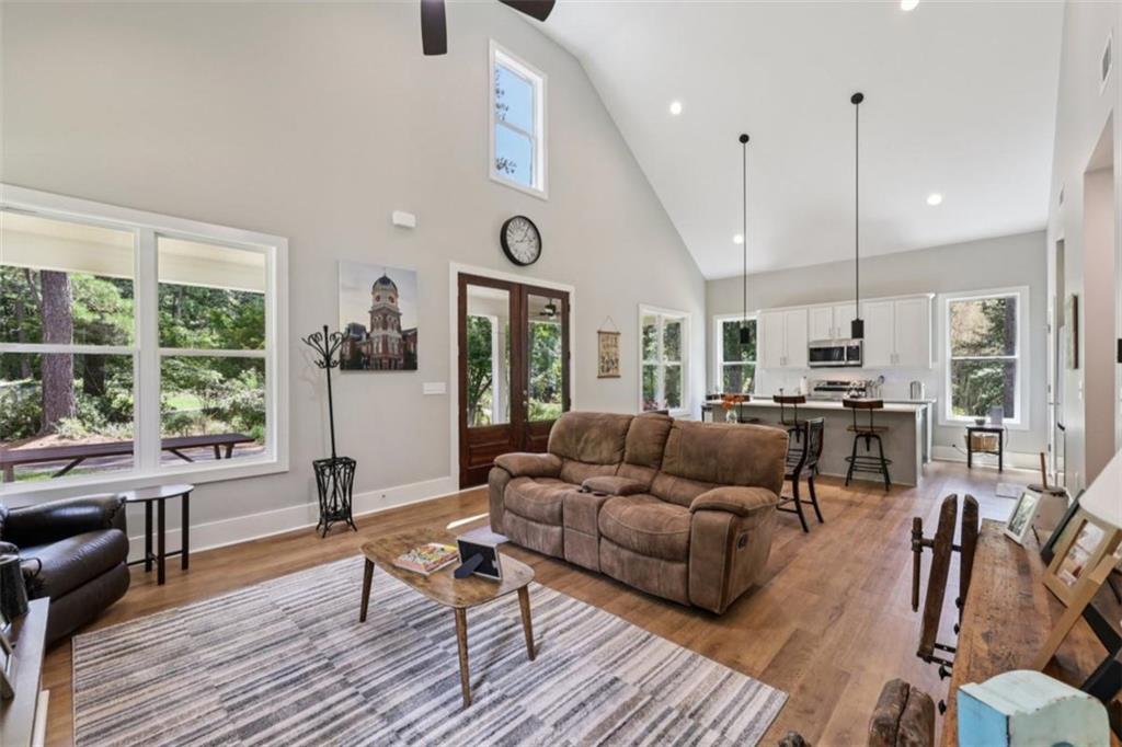 250 Stagecoach Road Oxford, GA 30054 - Photo 16 of 76 a living room with furniture and a wooden floor
