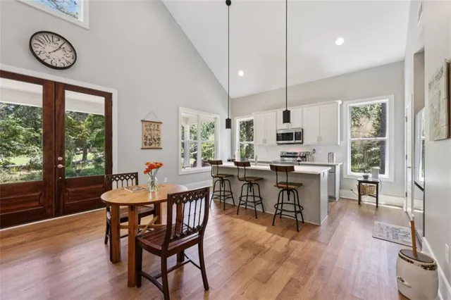 a view of a dining room with furniture window and wooden floor