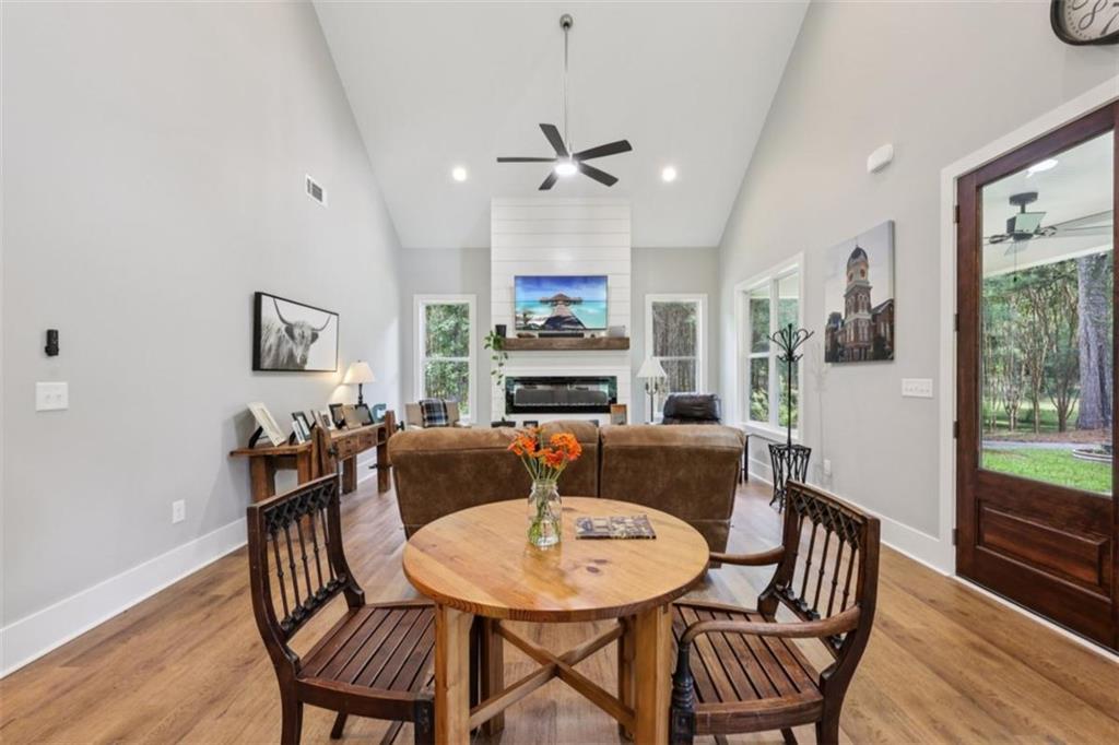 250 Stagecoach Road Oxford, GA 30054 - Photo 21 of 76 a view of a dining room with furniture window and wooden floor