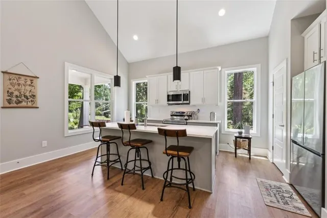 a kitchen with a sink and a microwave