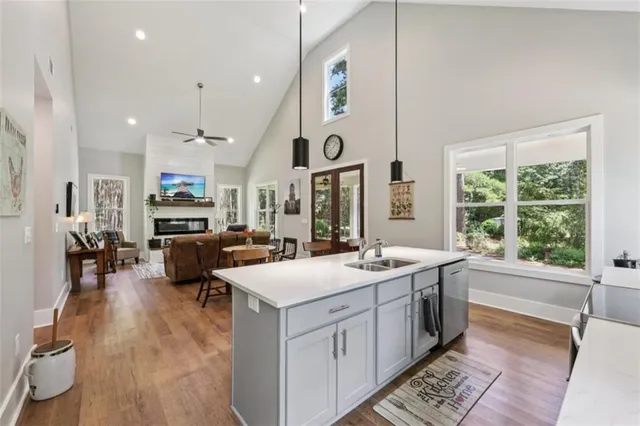 a bedroom with a bed and ceiling chandelier