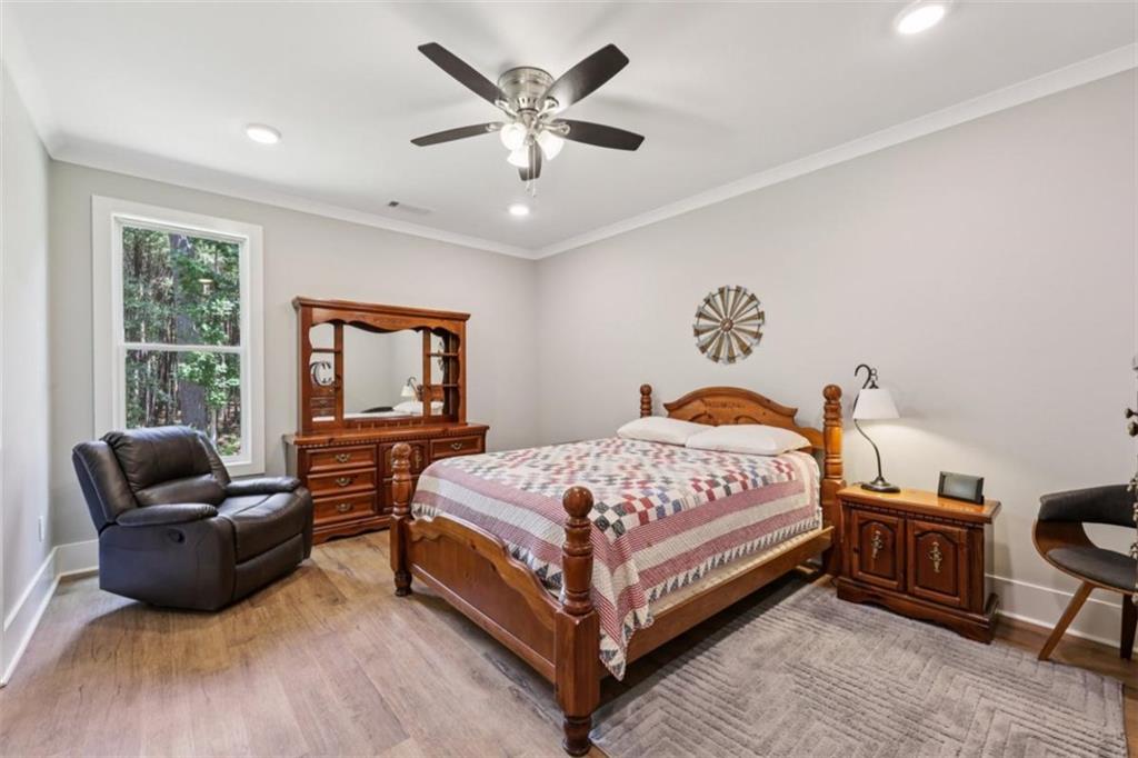 250 Stagecoach Road Oxford, GA 30054 - Photo 32 of 76 a bedroom with a bed and a couch