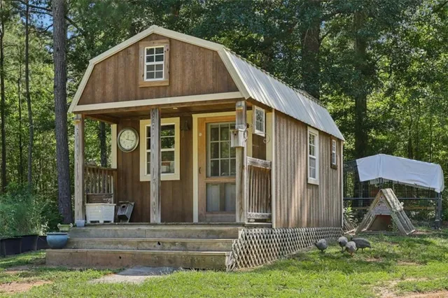 front view of a house with a tree