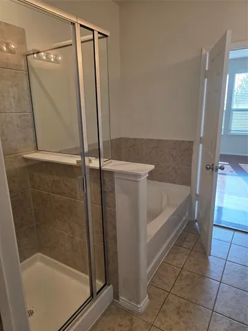 a very nice looking room with wooden floor