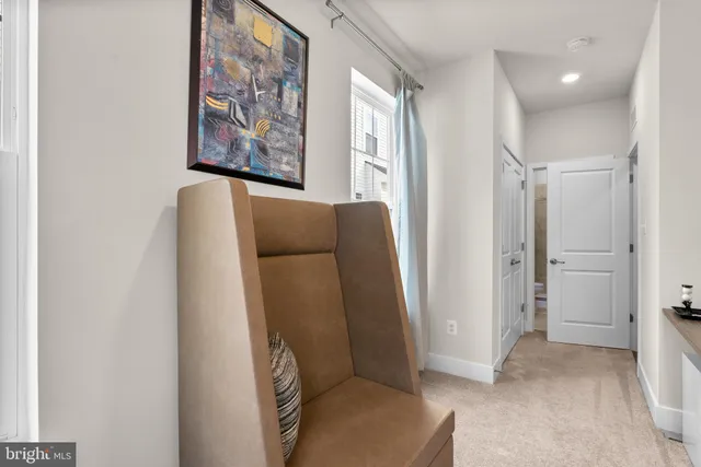 a bedroom with a bed couch and window