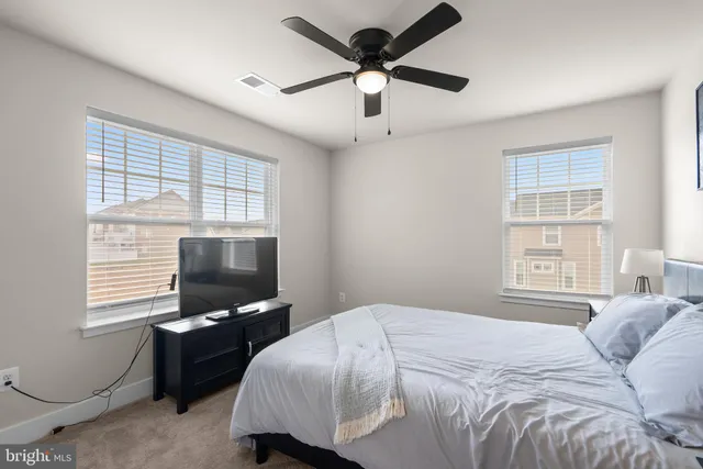 a view of a livingroom with furniture and wooden floor