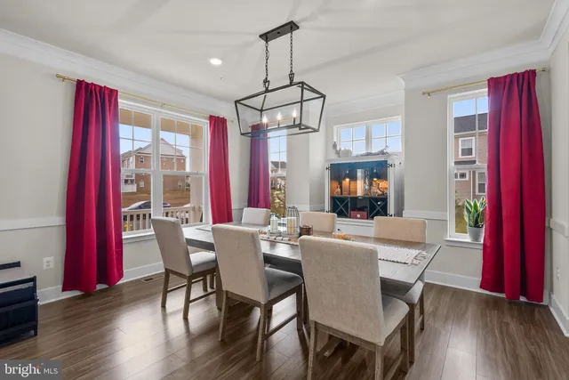 a view of a livingroom with furniture wooden floor and chandelier