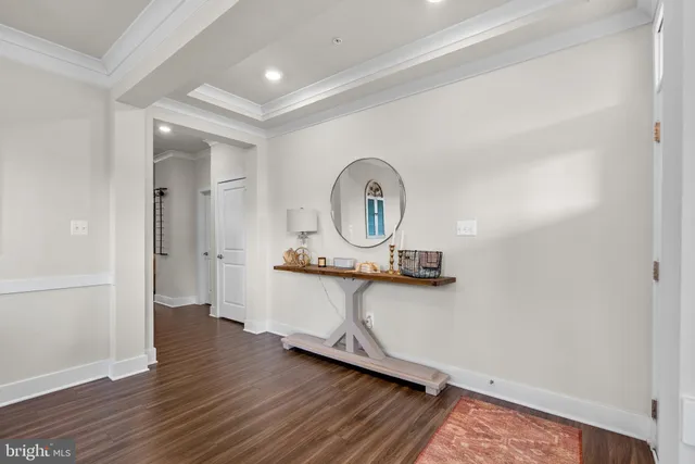 a dining room with stainless steel appliances kitchen island granite countertop a dining table chairs and a kitchen view
