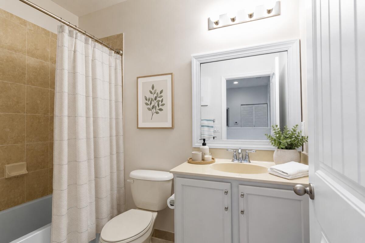 468 Francesca Ridge Road Boynton Beach, FL 33435 - Photo 8 of 11 a bathroom with a sink a toilet and shower curtain