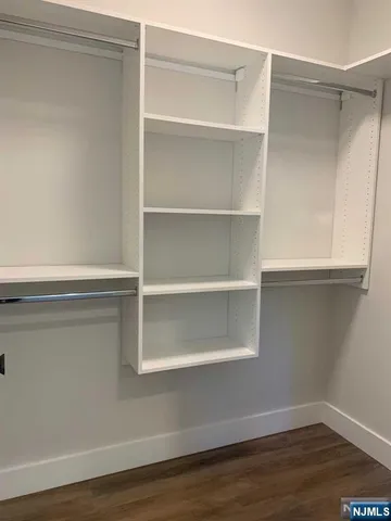 a view of an empty walk in closet