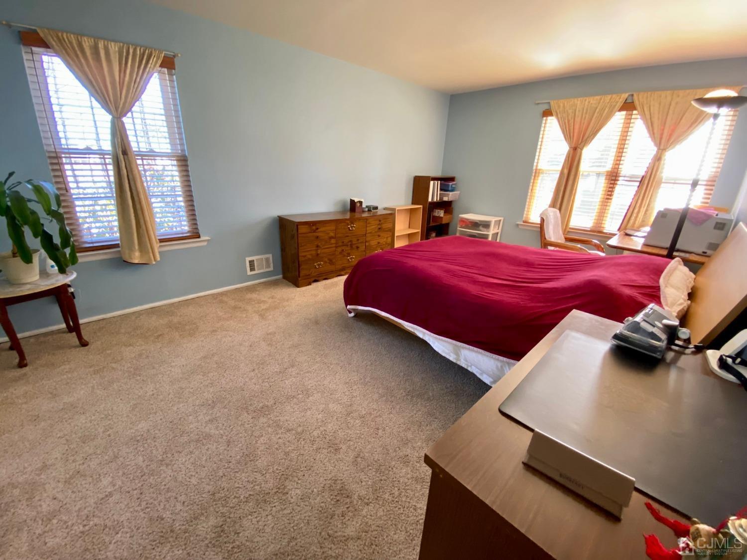 51 Boulder Drive Edison, NJ 08817 - Photo 14 of 24 a bedroom with a bed and a window