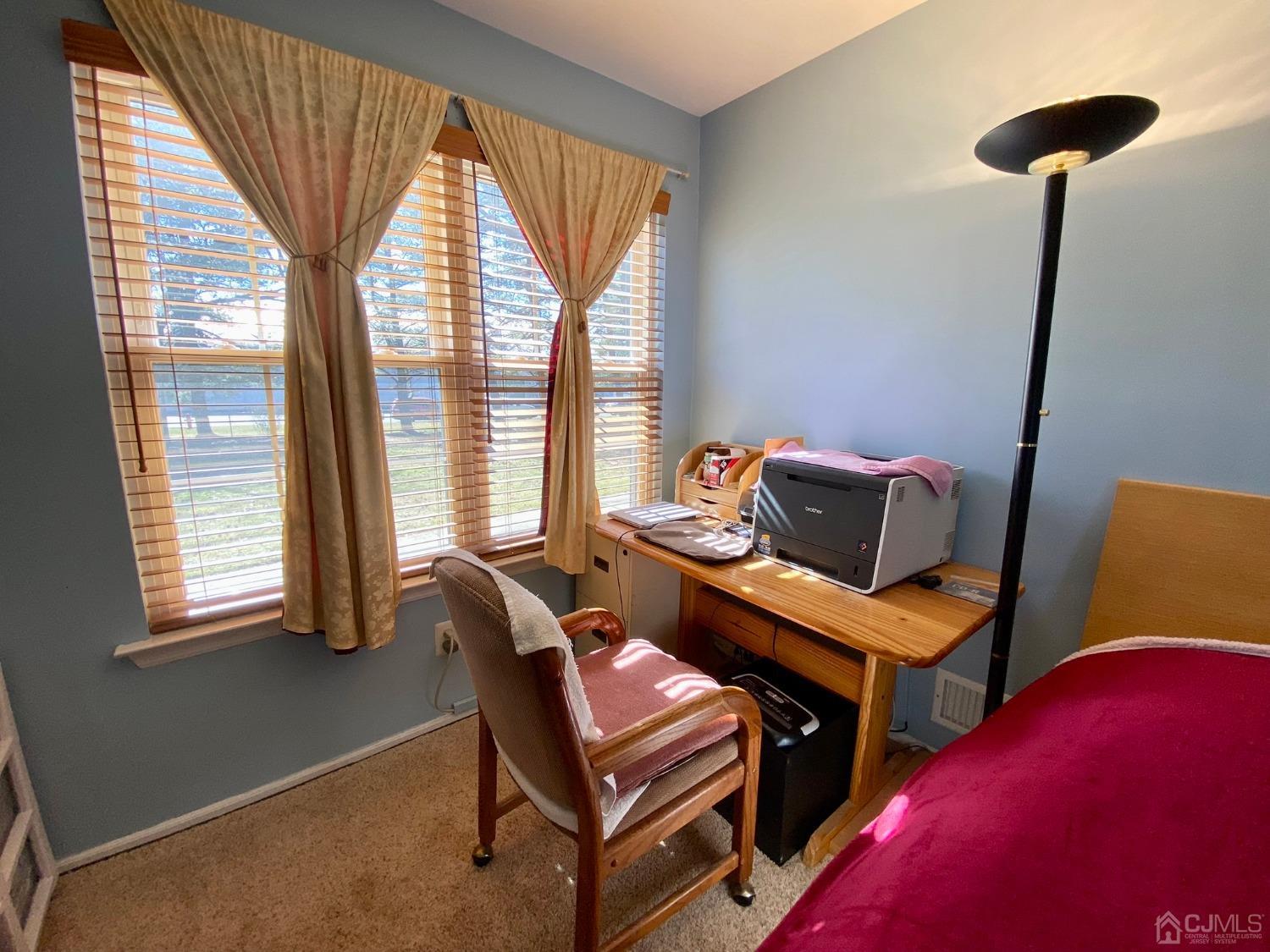 51 Boulder Drive Edison, NJ 08817 - Photo 15 of 24 a living room with furniture and a window