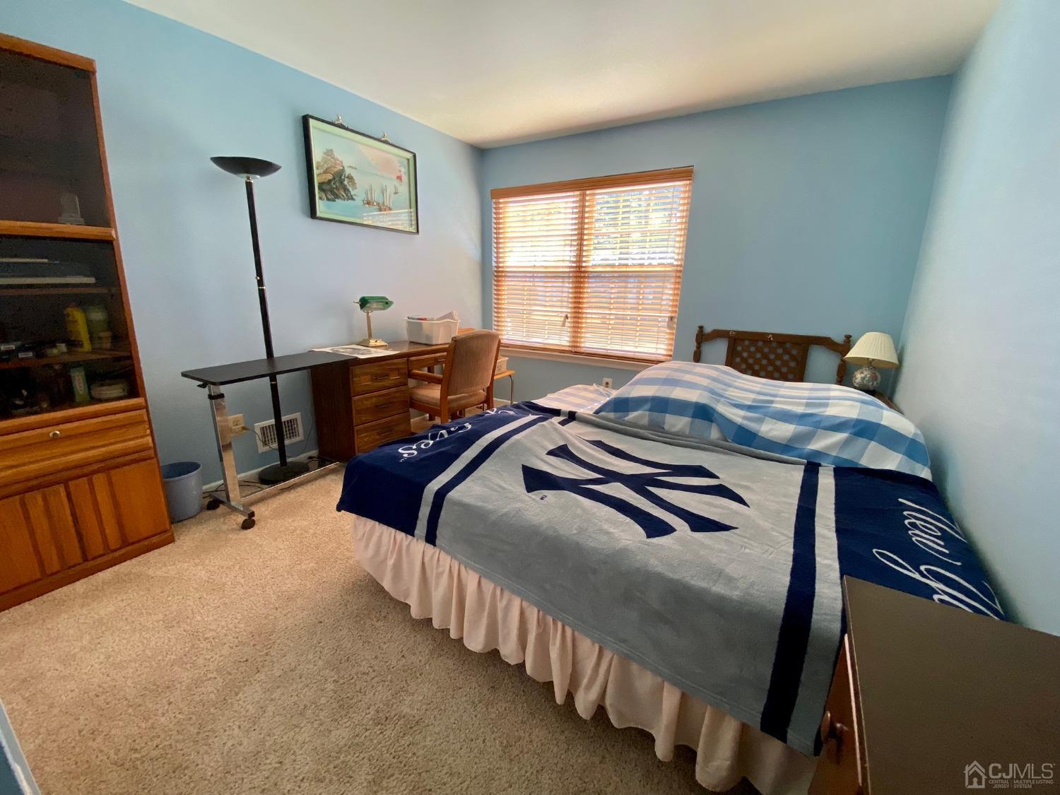 51 Boulder Drive Edison, NJ 08817 - Photo 19 of 24 a bedroom with two beds and a window